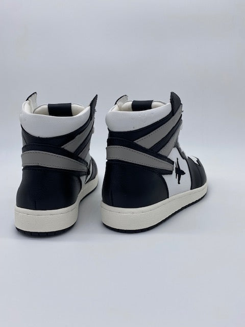 Black and white high top sneakers with Jet embroidered on the side with contrail.