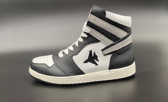 Black and white high top sneakers with Jet embroidered on the side with contrail.