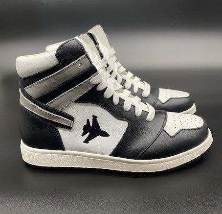 Black and white high top sneakers with Jet embroidered on the side with contrail.